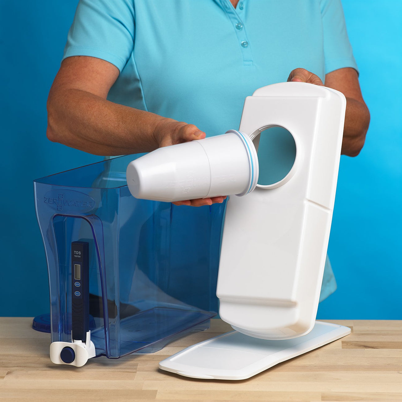 Woman installing water filter in water dispenser | ZeroWater